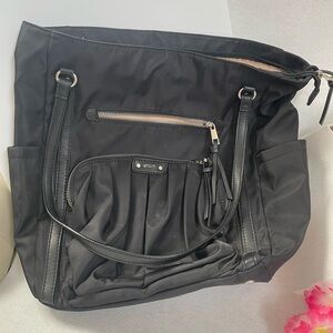 Great bag! Roomy, trolley strap, lightweight. Water resistant. Like new.